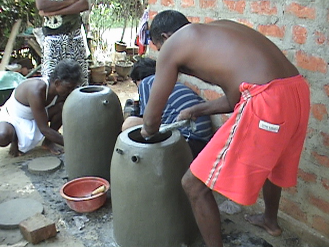 Trainees making ferro-cement water tanks